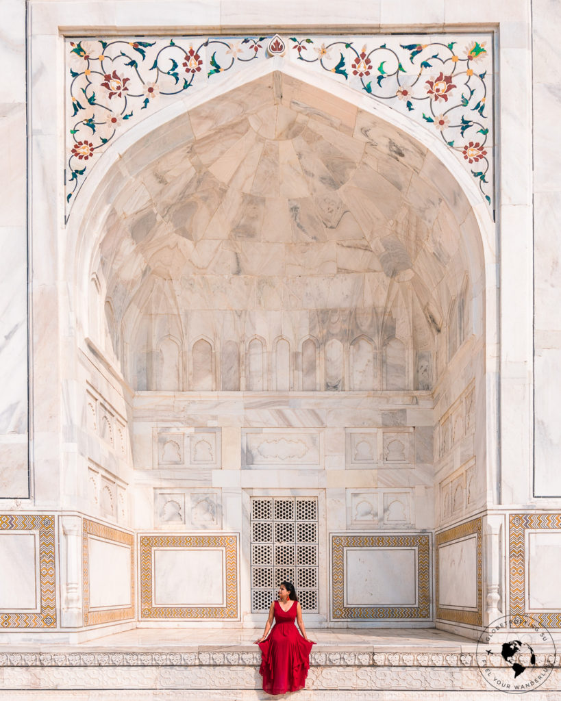 Girl sitting and admiring the details of the Mausoleum at Taj Mahal