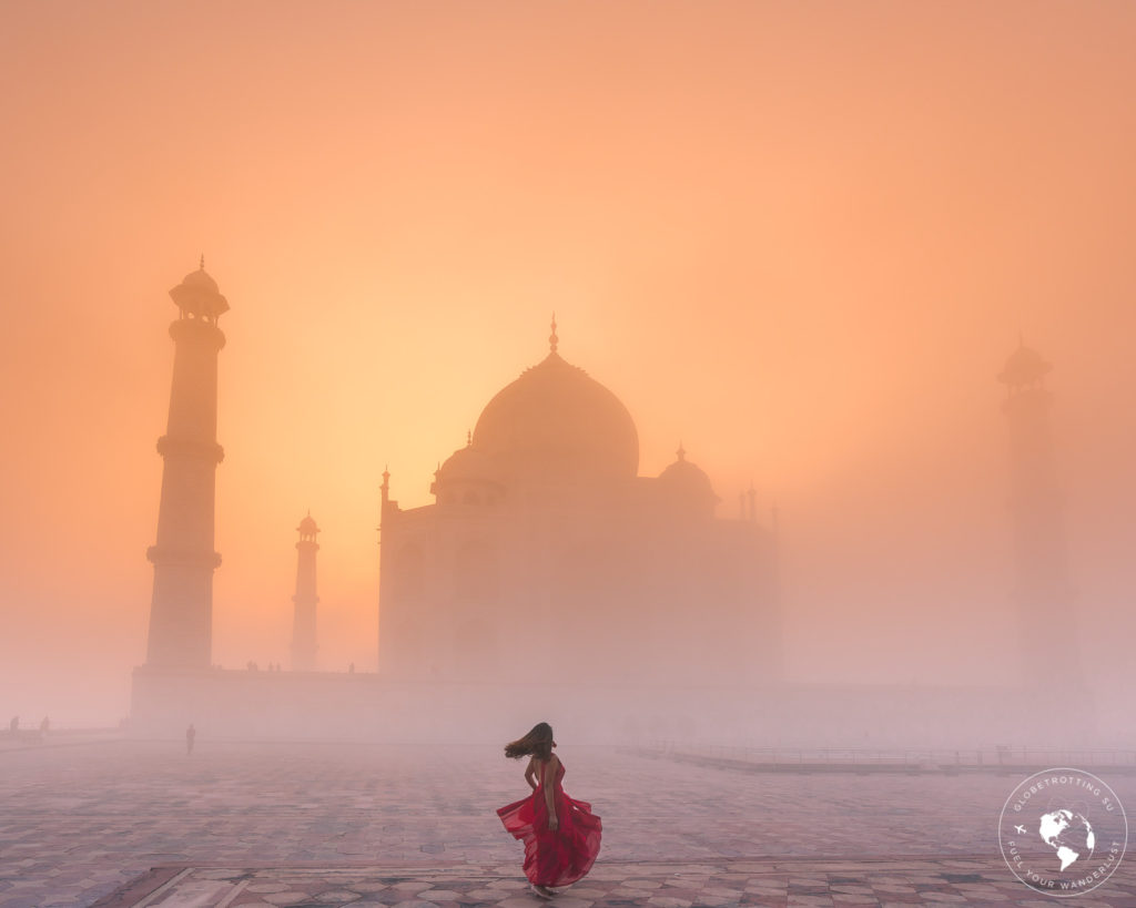 Girl dancing during the golden glow sunrise at Taj Mahal