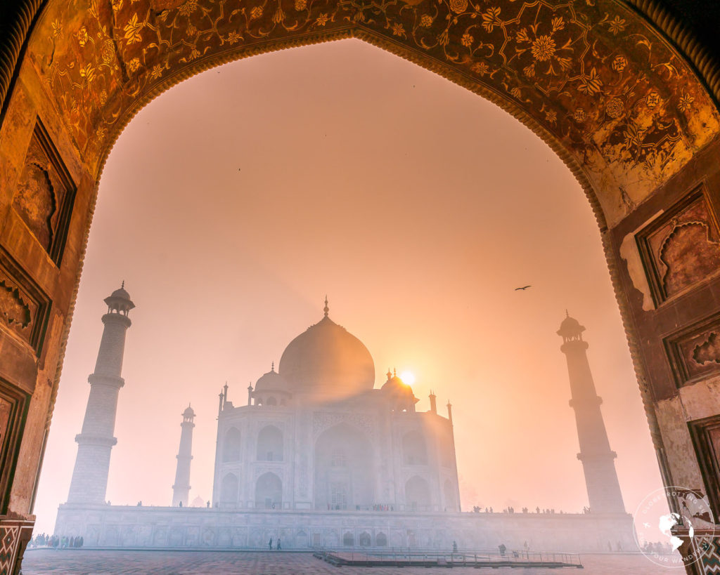 Sunrise at Taj Mahal viewed from the mosque on a winter morning