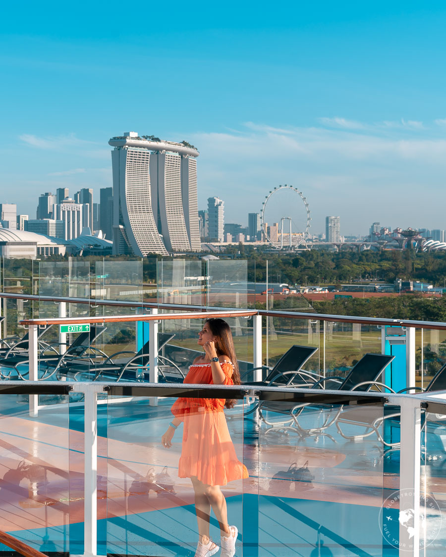 Girl enjoying the views of Singapore skyline from Royal Caribbean Cruise