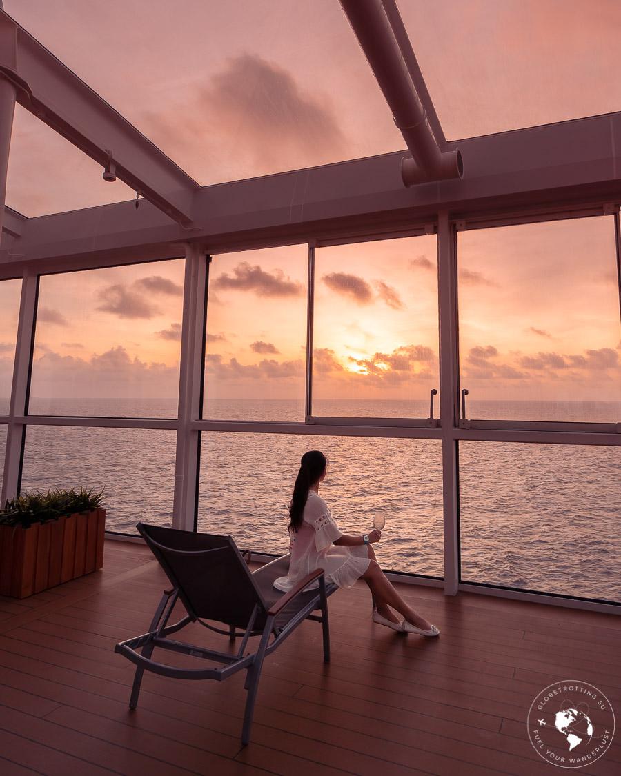 Girl enjoying the surreal sunset from Solariu of Royal Caribbean