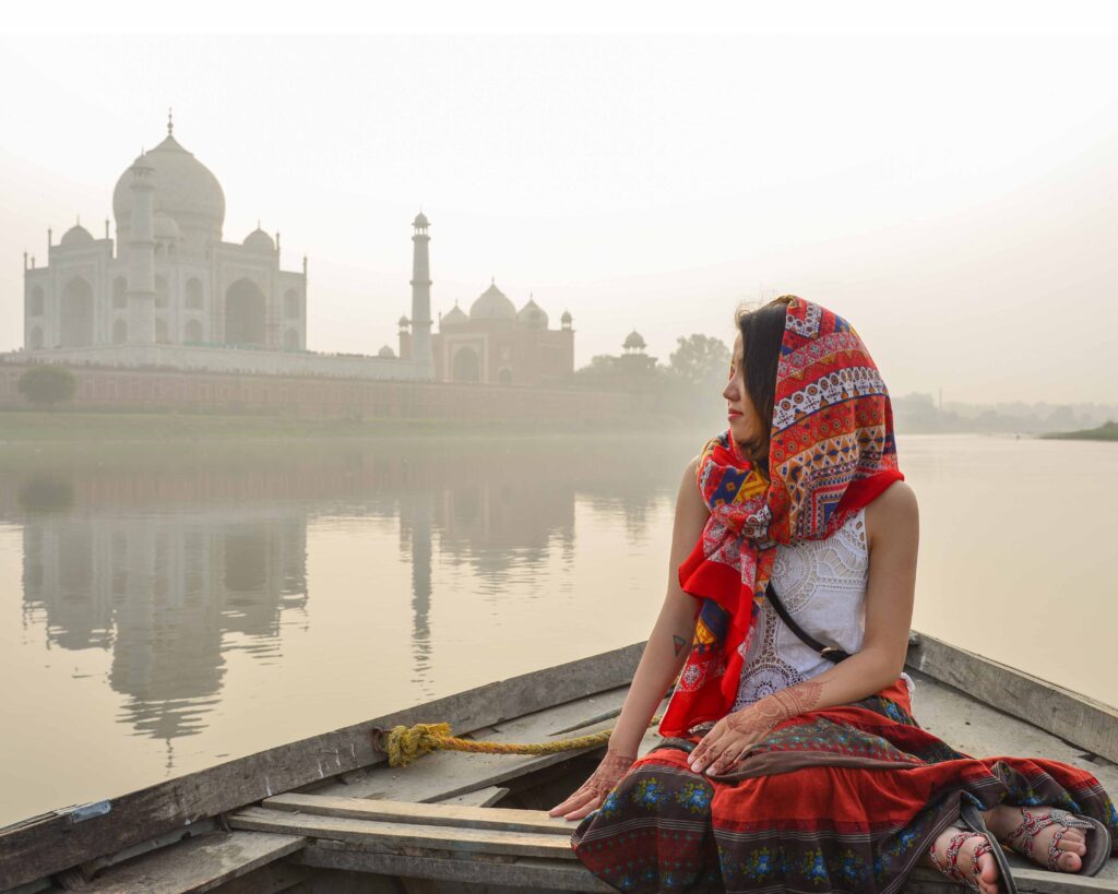 Girl watching the Taj Mahal during the Yamuna river Boat ride